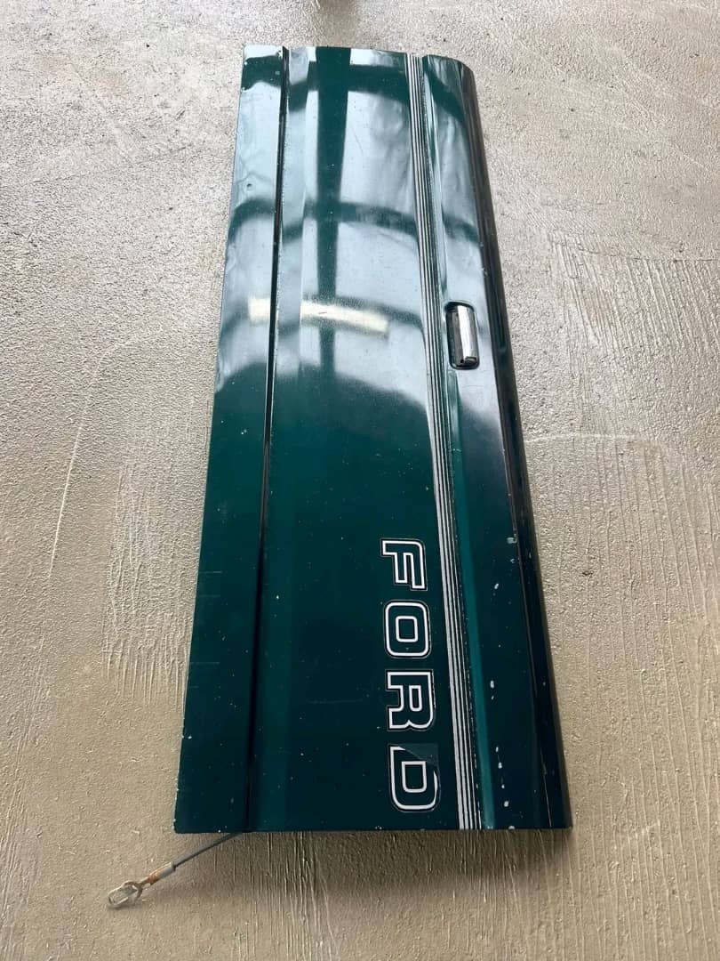 WhatsApp Image 2026-07-16 at 7.32.52 AM OEM 1992–1996 OBS Ford green tailgate with center trim panel for sale in Miami, FL